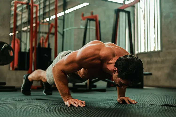 muscular man doing push ups