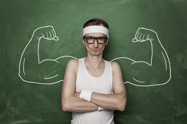 skinny guy who can't build muscle with big arms drawn on chalk board